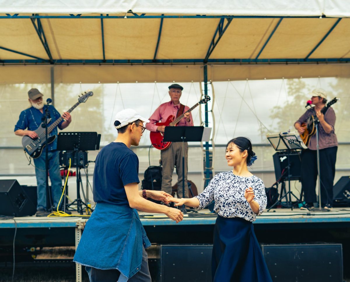 A couple dances to a live band